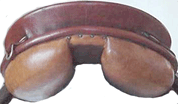 As the saddle is pressed down behind<br>the panels flatten and narrow the channel